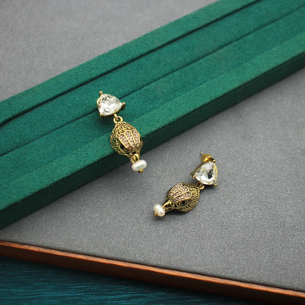 Brincos vintage de cabeça de á - Women'S Eagles Accessories avaliação e preço